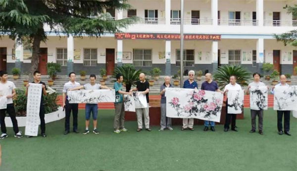 民盟武都區總支部-盟員書畫家進校園-翰墨飄香傳播文明343xg.jpg